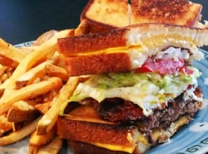 The menu at Little Jerry's is loaded with cleverly named items like the "Mimbo," a burger topped with bacon, egg, lettuce and tomato and wedged between to melty grilled cheese sandwiches.