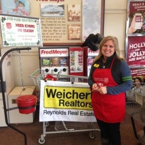The entire team at Reynold's Real Estate embraces giving back to the community.  Broker Jayne Christianson is seen here ringing the Salvation Army bell last holiday season. 