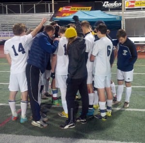 The Crusaders come together as a team after winning their state semifinal match.
