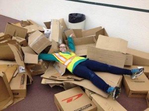 Mariah Seller ’17 stops to make a cardboard box angel as she collects boxes for recycling.