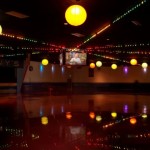 Beautifully mirror-polished, the floor reflects the multi-colored lights and lanterns strung across the ceiling