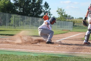 The Knights are known for their aggressive style of play, and stealing bases is one of their well-known weapons. Here 14U leadoff Tim Hughes easily slides into home.