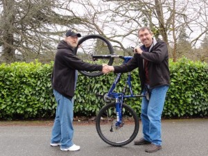 Mike the Mechanic delivers a refurbished mountain bike to a veteran.