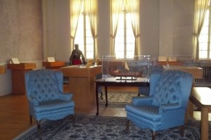 In the Main Hall, documents are enclosed in glass cases surrounding a sitting area.