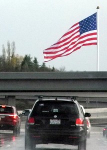 The Tacoma Screw Products flag sits in the windshield view of thousands of commuters along State Route 16 all day, every day. Photo by Steve Dunkelberger.