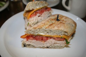 The Rosewood Café’s The Wood is a turkey sandwich with smoky bacon and cheese mixed with fresh veggies and basil on a rustic olive roll.