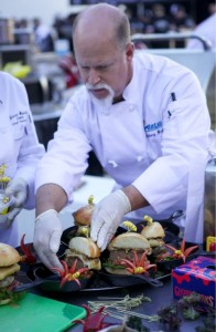 Culinary Arts student Tony Brooks puts finishing touches on the burger.