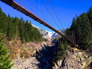 The Tahoma Creek Suspension Bridge swings for 200 feet, supported only by cables and a wooden walkwayPhoto by Douglas Scott.