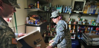Soldiers unload food at Tillicum food bank.