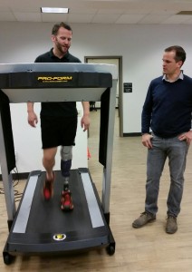Ryan works with patient Nick Roumonada, an Iron Man Triathlete, on his new test prosthesis.
