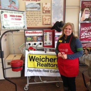 The entire team at Reynold's Real Estate embraces giving back to the community. Broker Jayne Christianson is seen here ringing the Salvation Army bell last holiday season.