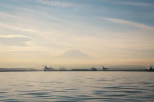 Stunning Mount Rainier is the backdrop to Tacoma's bustling, industrial port. Photo credit: Aaron Jorgenson.