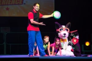 Diggy the Dog joins audience members on stage during Stunt Dog Experience. Photo courtesy: The Washington Center for the Performing Arts.