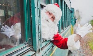Santa rides the rails every weekend through the holidays on a historic train trip with views of Mount Rainier. Photo courtesy: Mount Rainier Scenic Railroad.