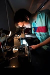 Puget Sound student works in a science laboratory. Photo by Ross Mulhausen, University of Puget Sound.