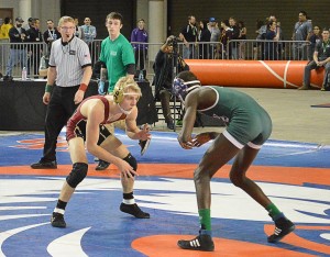 Enumclaw's Kyle Opland (left) won the 120-pound 3A title with a win over Sidat Kanyi of Edmonds-Woodway.