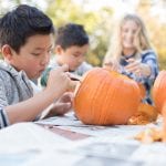 Children carving pumpkins