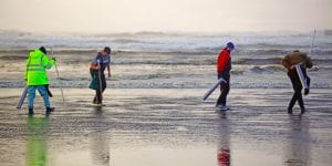 clam diggers on beach 